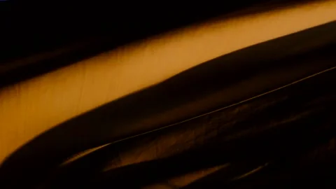 Low angle shot of sails blowing in stormy wind on waterfront at sunset Stock Footage 245948733