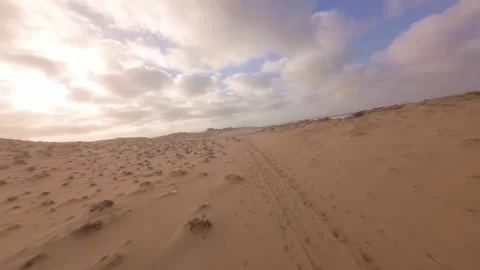 Low angle shot of sand dunes near ocean. After the storm Video stock 345149618