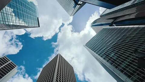 A low-angle shot showcasing a cluster of modern skyscrapers in central Hong Kong Stock Footage 338165319