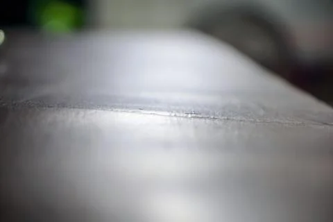 Low angle shot showcasing the texture details of a gray metal surface 스톡 사진