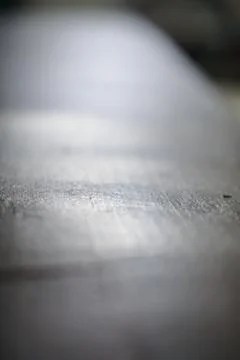 Low angle shot showcasing the texture details of a gray metal surface 스톡 사진