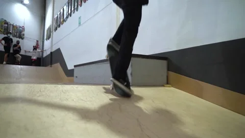 Low angle shot of skateboarder sliding and grinding on rail, getting Stock Footage 142849230