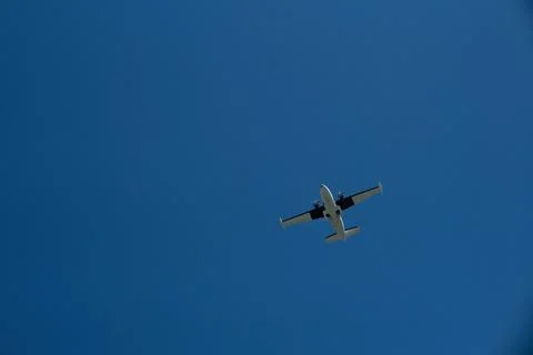 Low-Angle Shot of a Small Propeller Aircraft in Sunny Blue Skies Stock Photos
