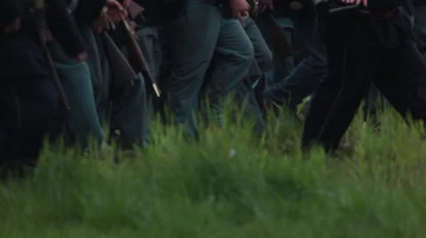 Low angle shot of soldiers marching through grass Stock-Footage 39983354