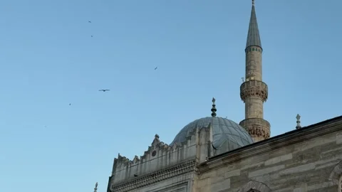 Low angle shot stone dome and minaret of a mosque silhouetted Stock Footage 340154887