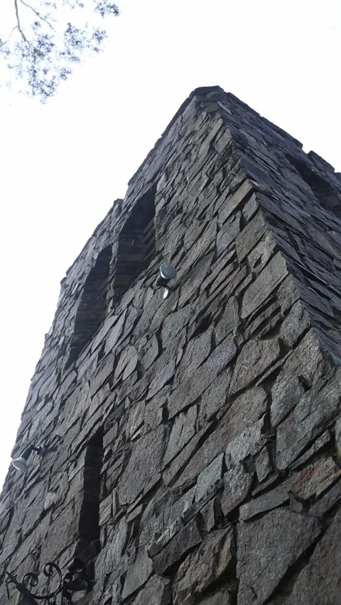 Low angle shot of stone tower against white background Stock Footage 341912487
