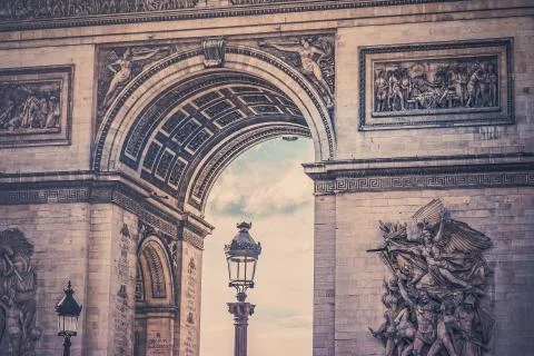 Low angle shot of a street light near the Arch of Triumph in Paris, France Stock Photos