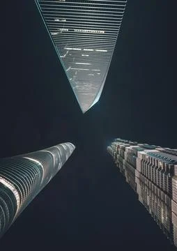 A low-angle shot of three impressive skyscrapers in Shanghai. Stock Photos
