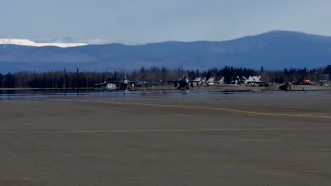 Low Angle Shot of Three Military Jets on a Runway Stock Footage 130358064
