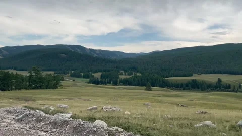 Low angle shot tilt shot from road to sky offroad in Ulagan, Ukok valley, ALtai Stock Footage 253256822