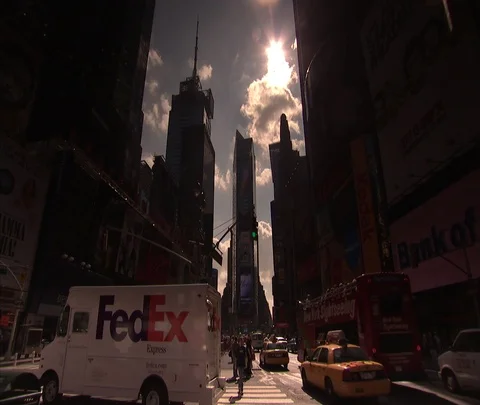 Low angle shot of traffic heading into Times Square Stock Footage 86699699