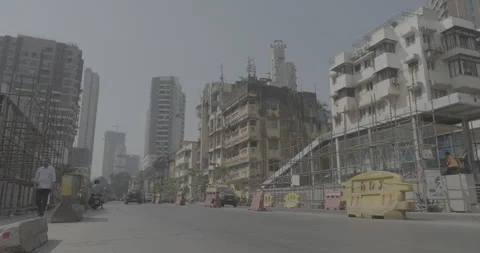 Low Angle Shot of Vehicles on Busy Mumbai Road During Daytime Stock Footage 310606387