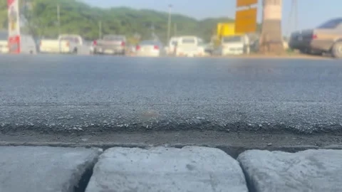 Low-angle shot of vehicles driving on a road Stock Footage 311502382