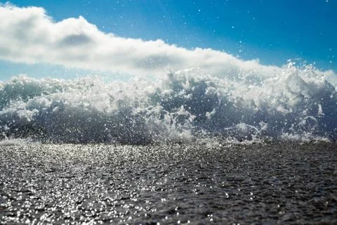 Low angle shot of waves breaking on the beach of Antogafasta, Chile Stock Photos