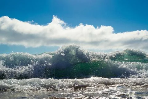 Low angle shot of waves breaking on the beach of Antogafasta, Chile Stock Photos