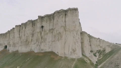 Low angle shot of a white limestone cliff wall Video stock 333836928