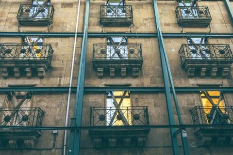 Low angle shot of X shaped frames on the windows of the building Stock Photos
