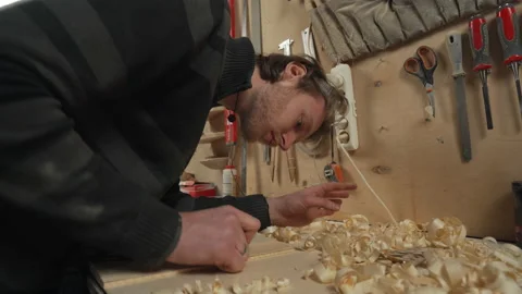 Low angle shot young joiner work with jointer in his workshop slow motion Video stock 155619397