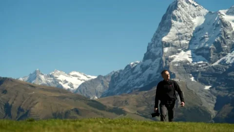 Low angle shot of a young man walking towards the camera Stock Footage 201164986