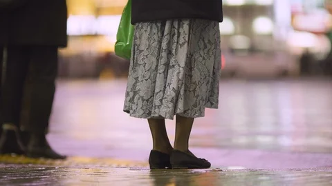 Low angle shots of people crossing Shibuya square on a rainy night Видео 123799271