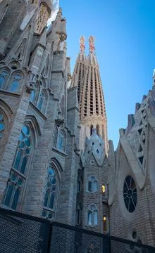 Low angle side view to the towers of Passion Facade of the Sagrada Familia Stock Photos