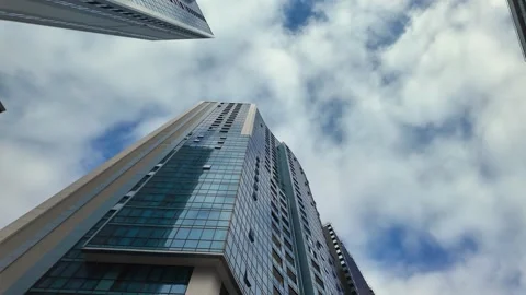 Low angle skyscraper view with moving clouds Video stock 338163552