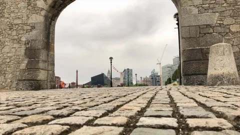 Low angle slide clip of arch entrance at Salthouse Dock  in Liverpool, UK Stock Footage 99736130