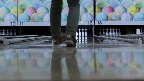 LOW ANGLE SLIDER DOLLY FOOT VIEW OF MALE BOWLER WHO ALMOST GETS A STRIKE Video stock 85107306