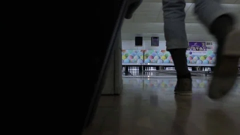 LOW ANGLE SLIDER DOLLY VIEW OF FEMALE BOWLER ALMOST GETTING A STRIKE  Stock Footage 85107245