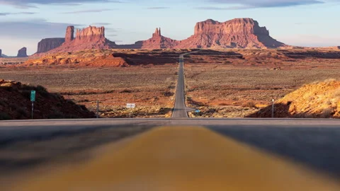 Low Angle Slider of Monument Valley as Heat Ripples Rise Stock Footage 146148823