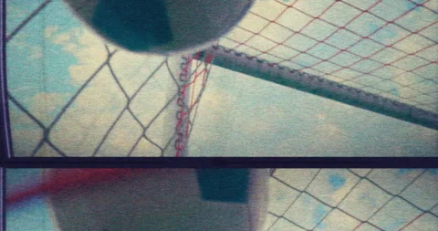 Low-angle slow-mo showing a soccer ball hitting the net and scoring a goal Stock-Footage 276903494