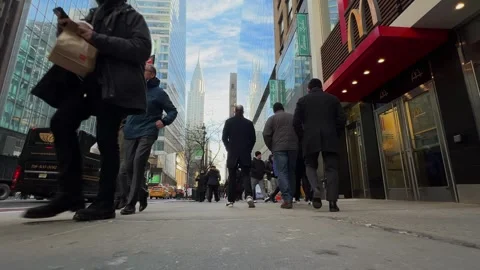 Low angle slow motion pedestrians on Manhattan street, NYC Vídeos de archivo 308908697