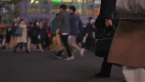 Low angle slow motion of people at Shibuya crosswalk at night in Tokyo, Japan Stock Footage 120025414
