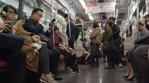 Low angle slow-motion shot of a Japanese subway train in Tokyo, Japan. Stock Footage 126892617