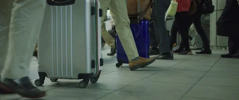 Low angle slow motion shot of people walking at airport, Tokyo Stock Footage 136118867