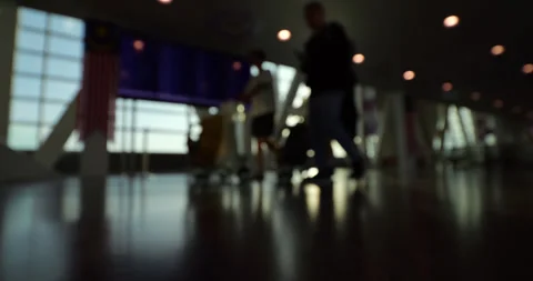 Low angle slow motion shot of air passengers, blurred silhouettes Vídeos de archivo 329460585