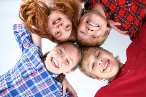 Low angle of smiling friends Foto stock