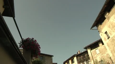 Low Angle, Spinning shot of buildings in Carona, Switzerland Stock Footage 11880960