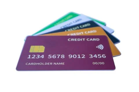 Low-angle stack of colorful credit cards featuring purple, orange, dark blu.. Stock Photos