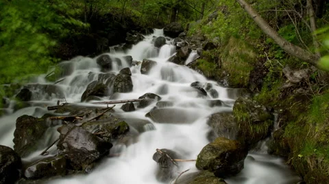 Low angle stationary time lapse view of a gorgeous rocky waterfall in Alaska. Stock Footage 52217929