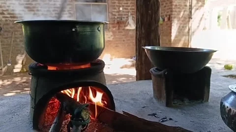 Low Angle Stirring Curry On Wood Fire Stove 動画素材 335275575