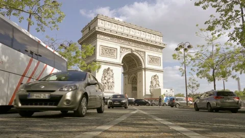 Low angle street view Arc de Triomphe - famous monument with cars driving Paris Stock Footage 93813656