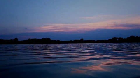 Low Angle Sunset On Lake Water (With Bird Fly By) Stock-Footage 25425758
