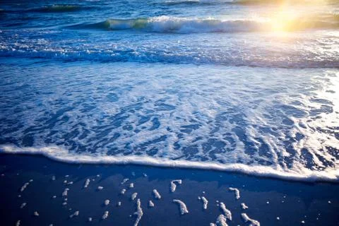 Low angle sunset over a tropical ocean Stock Photos