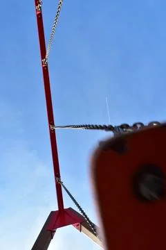 Low angle swing on a blue sky Stock Photos