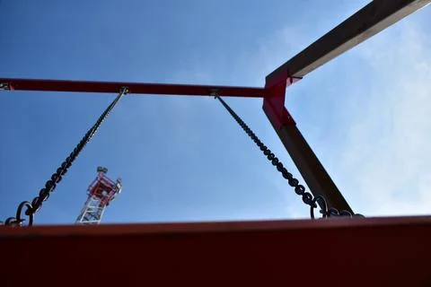 Low angle swing on a blue sky Stock Photos