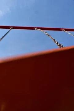 Low angle swing on a blue sky Stock Photos