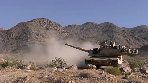 Low Angle of a Tank Passing Right to Left With Soldiers on Top Stock Footage 130361270