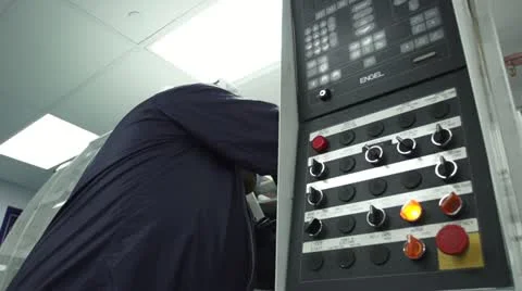 Low Angle of Technician working at Machine in Cleanroom Stock Footage 10895853