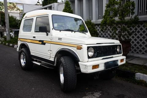 Low Angle Three Quarter View of Iconic White Compact SUV Jimny Katana with .. Stock Photos